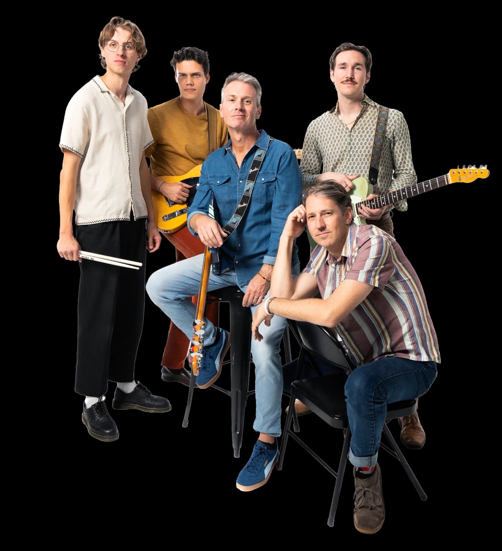 The five members of The Swell together in the studio, with guitars and drumsticks.